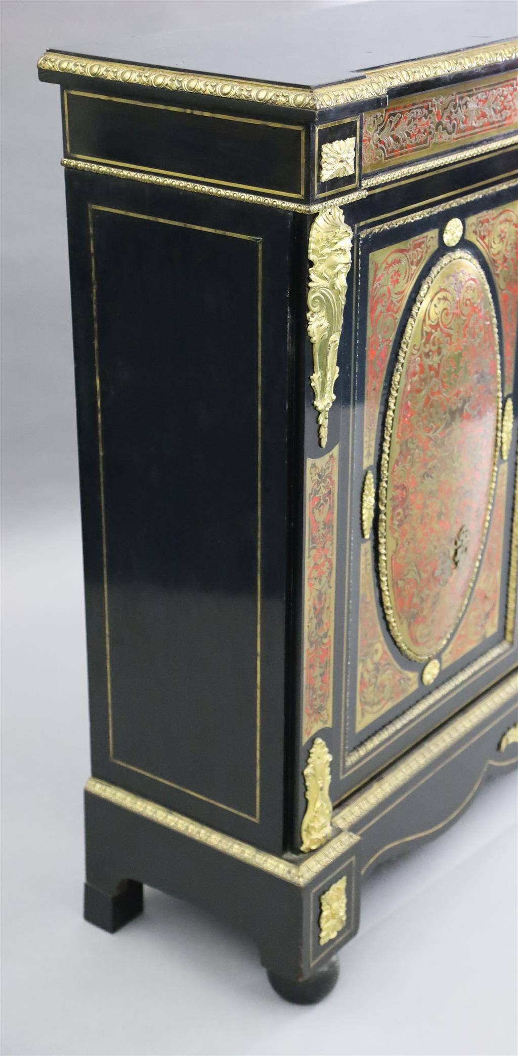 A 19th century French red buhl work and ebony side cabinet, W.4ft 4in. D.1ft 4in. H.3ft 11in.